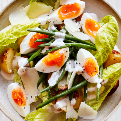 Jersey Royals with lentils, capers, mint and a boiled egg / Riverford